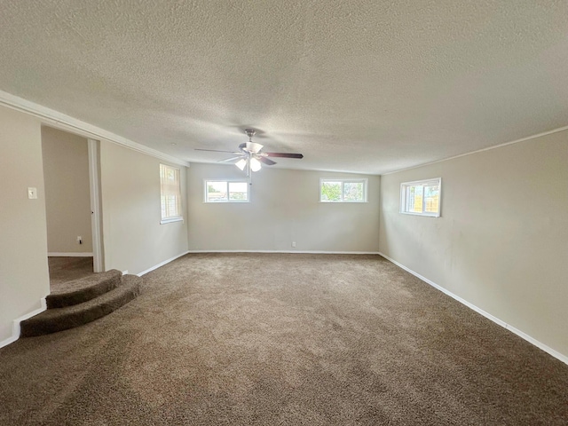 213 Green Valley Rd NW, Los Ranchos, NM 87107 - carpeted spare room with ceiling fan and a textured ceiling