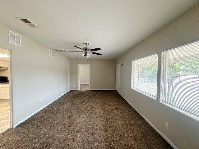 213 Green Valley Rd NW, Los Ranchos, NM 87107 - unfurnished room featuring carpet and a ceiling fan