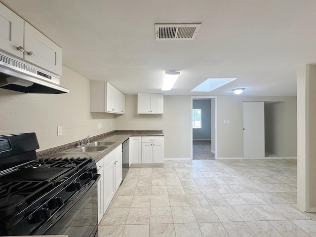 213 Green Valley Rd NW, Los Ranchos, NM 87107 - kitchen with gas range oven, ventilation hood, dishwasher, a skylight, and white cabinets