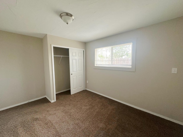 213 Green Valley Rd NW, Los Ranchos, NM 87107 - unfurnished bedroom featuring a closet and carpet flooring