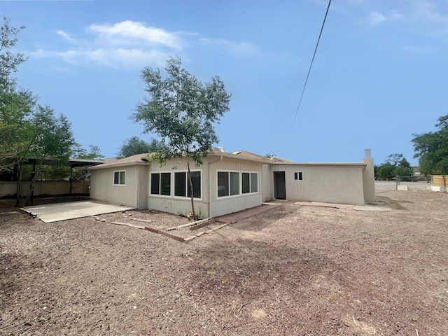 213 Green Valley Rd NW, Los Ranchos, NM 87107 - back of house with a patio and a chimney