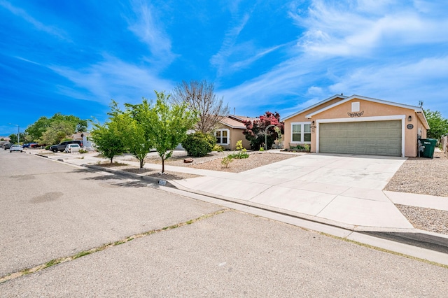 3742 Cattle Dr NE, Rio Rancho, NM 87144 - view of front of house with stucco siding, driveway, and an attached garage