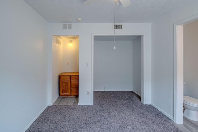 3742 Cattle Dr NE, Rio Rancho, NM 87144 - unfurnished bedroom with carpet flooring, a closet, a textured ceiling, and ceiling fan