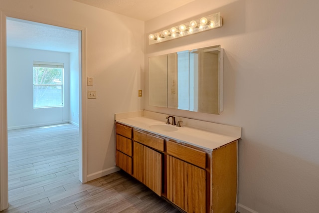 3742 Cattle Dr NE, Rio Rancho, NM 87144 - bathroom featuring vanity and wood finished floors