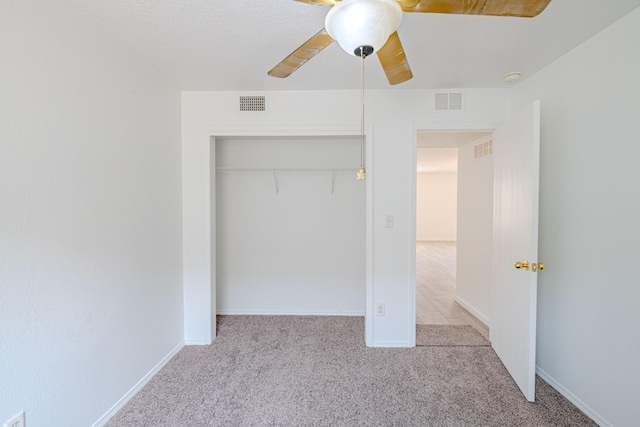 3742 Cattle Dr NE, Rio Rancho, NM 87144 - unfurnished bedroom with carpet flooring, a closet, and a ceiling fan