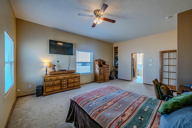 300 Thompson, Moriarty, NM 87035 - bedroom featuring carpet flooring, a textured ceiling, and ceiling fan