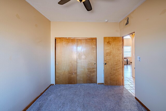 300 Thompson, Moriarty, NM 87035 - unfurnished bedroom featuring carpet floors and ceiling fan