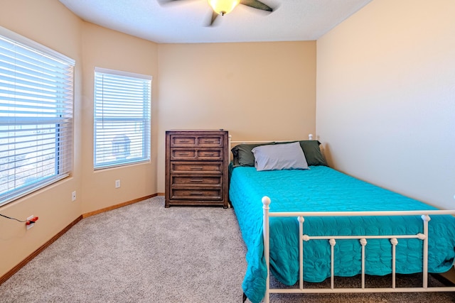 300 Thompson, Moriarty, NM 87035 - carpeted bedroom with a ceiling fan and baseboards