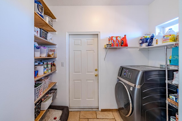 300 Thompson, Moriarty, NM 87035 - laundry area featuring washer / clothes dryer and baseboards