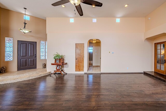 300 Thompson, Moriarty, NM 87035 - entryway featuring arched walkways, ceiling fan, wood finished floors, a towering ceiling, and recessed lighting