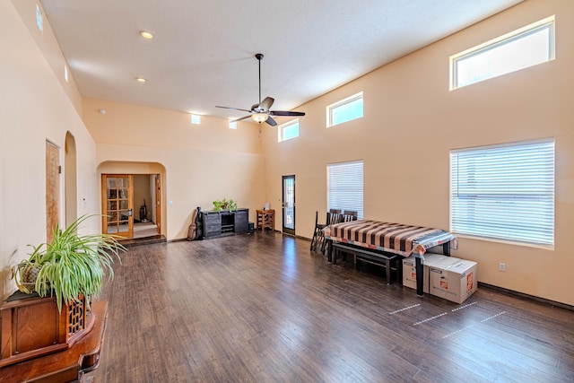 300 Thompson, Moriarty, NM 87035 - misc room featuring healthy amount of natural light, dark wood-type flooring, a ceiling fan, arched walkways, and a towering ceiling