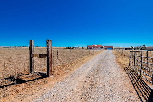 300 Thompson, Moriarty, NM 87035 - view of dirt / gravel road with a rural view and a gated entry