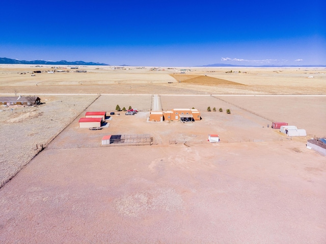 300 Thompson, Moriarty, NM 87035 - aerial view of sparsely populated area with a mountain backdrop