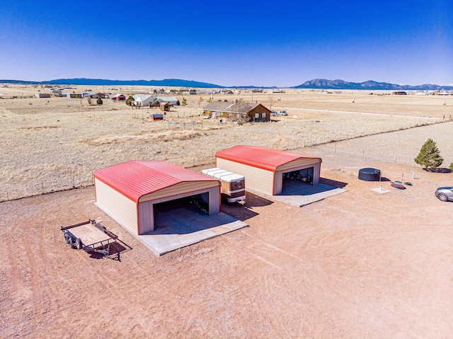 300 Thompson, Moriarty, NM 87035 - aerial view of sparsely populated area with a mountainous background and a desert landscape