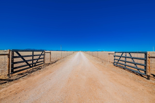 300 Thompson, Moriarty, NM 87035 - view of street with a rural view and a gated entry
