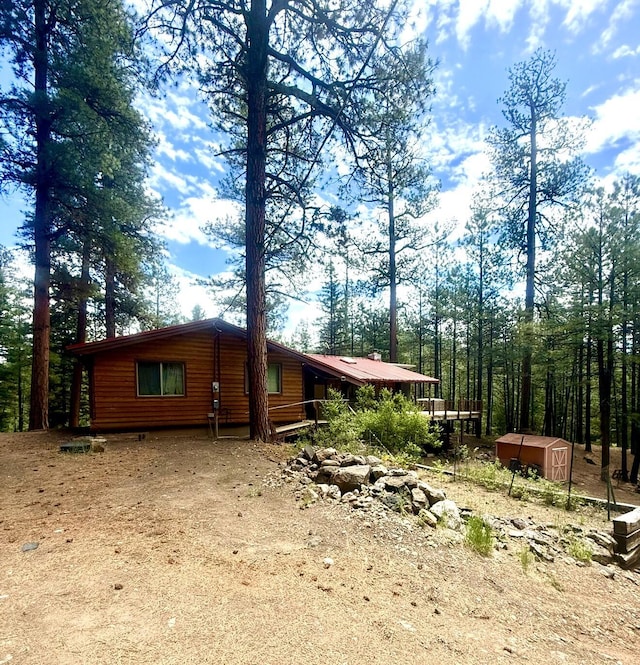 455 Obsidian Rd, Jemez Springs, NM 87025 - view of side of home featuring a storage shed