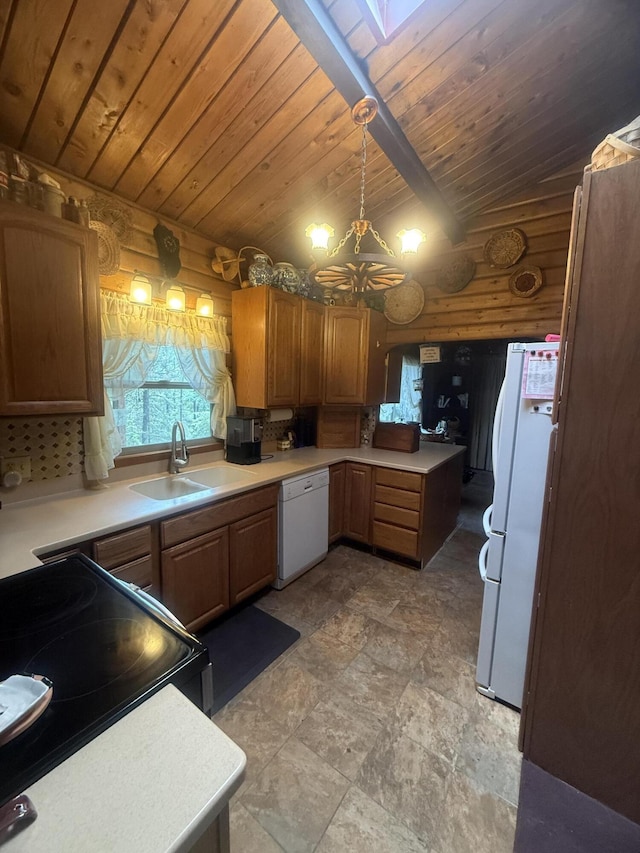 455 Obsidian Rd, Jemez Springs, NM 87025 - kitchen with white appliances, a wood ceiling with exposed beams, log walls, light countertops, and stone finish flooring