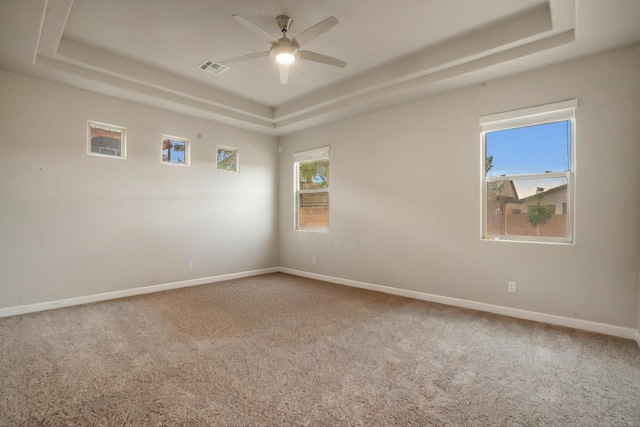 205 Silent Spring Dr NE, Rio Rancho, NM 87124 - carpeted empty room featuring a tray ceiling and ceiling fan