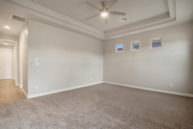 205 Silent Spring Dr NE, Rio Rancho, NM 87124 - carpeted spare room with ceiling fan, a raised ceiling, and recessed lighting