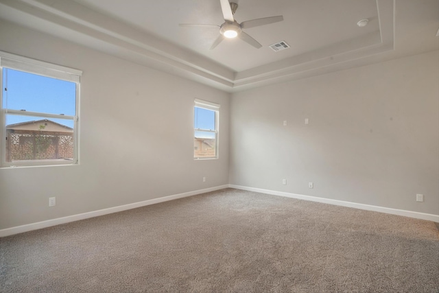 205 Silent Spring Dr NE, Rio Rancho, NM 87124 - unfurnished room with a raised ceiling, a ceiling fan, and carpet