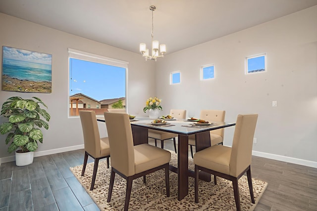 205 Silent Spring Dr NE, Rio Rancho, NM 87124 - dining room with a chandelier, plenty of natural light, and dark wood-style floors