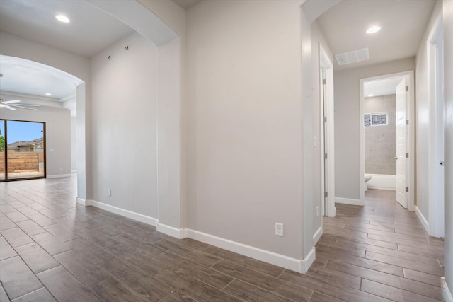 205 Silent Spring Dr NE, Rio Rancho, NM 87124 - hallway with arched walkways, dark wood-type flooring, and recessed lighting