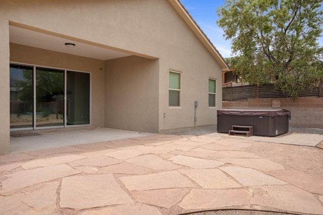 205 Silent Spring Dr NE, Rio Rancho, NM 87124 - view of patio / terrace featuring a hot tub