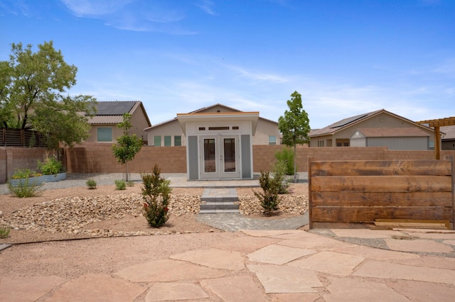 205 Silent Spring Dr NE, Rio Rancho, NM 87124 - back of house featuring french doors and a fenced backyard
