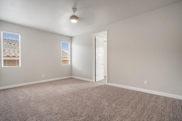 205 Silent Spring Dr NE, Rio Rancho, NM 87124 - spare room with light colored carpet and a ceiling fan