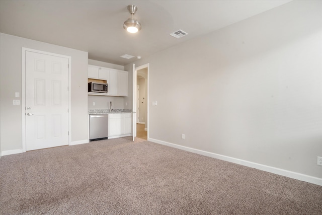 205 Silent Spring Dr NE, Rio Rancho, NM 87124 - unfurnished living room with light colored carpet and baseboards
