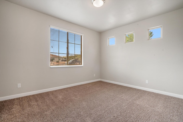 205 Silent Spring Dr NE, Rio Rancho, NM 87124 - carpeted empty room with baseboards