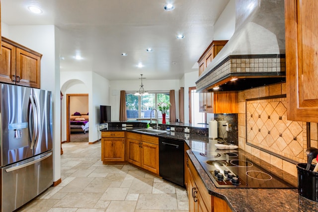 930 Titus Loop, Bosque Farms, NM 87068 - kitchen with black appliances, custom exhaust hood, brown cabinets, tasteful backsplash, and recessed lighting