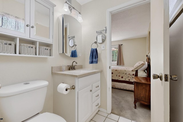 8804 San Francisco Rd NE, Albuquerque, NM 87109 - bathroom featuring connected bathroom, vanity, and tile patterned floors