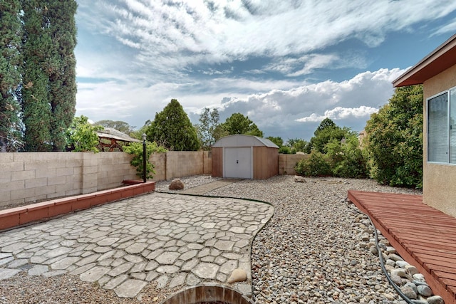 8804 San Francisco Rd NE, Albuquerque, NM 87109 - fenced backyard featuring a patio area and a shed