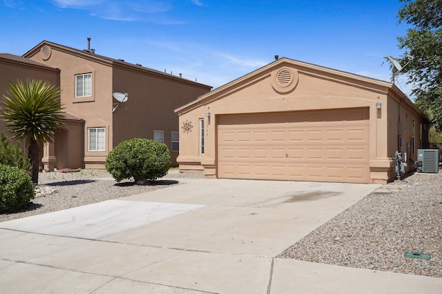 1944 Sierra Norte Loop NE, Rio Rancho, NM 87144 - view of front of home featuring stucco siding, an attached garage, and concrete driveway