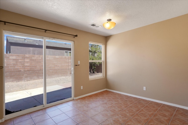 1944 Sierra Norte Loop NE, Rio Rancho, NM 87144 - unfurnished room with a textured ceiling and light tile patterned flooring