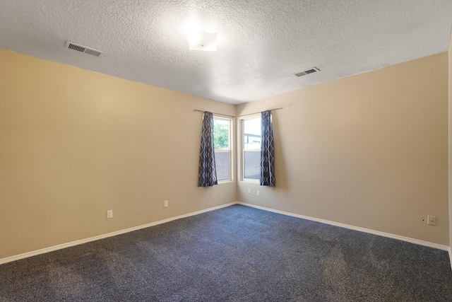 1944 Sierra Norte Loop NE, Rio Rancho, NM 87144 - empty room featuring a textured ceiling and dark carpet