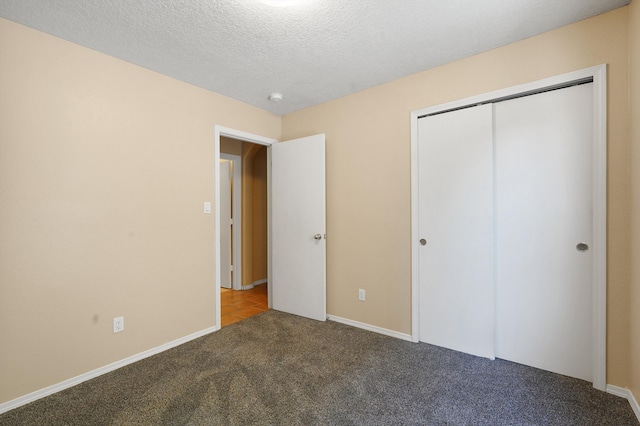 1944 Sierra Norte Loop NE, Rio Rancho, NM 87144 - unfurnished bedroom with carpet flooring, a textured ceiling, and a closet