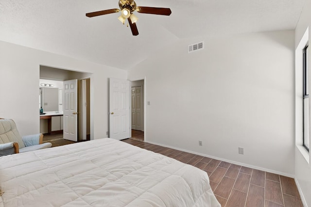 4577 Rockaway Loop NE, Rio Rancho, NM 87124 - bedroom with wood finish floors, vaulted ceiling, ensuite bath, and a ceiling fan
