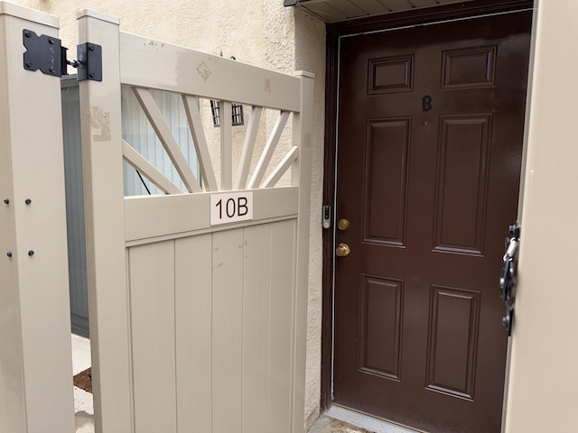 8333 Comanche Rd NE Unit 10B, Albuquerque, NM 87110 - doorway to property with stucco siding