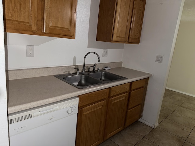 8333 Comanche Rd NE Unit 10B, Albuquerque, NM 87110 - kitchen featuring dishwasher, light countertops, tile patterned floors, and brown cabinets