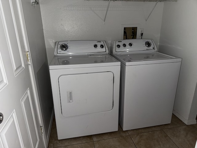 8333 Comanche Rd NE Unit 10B, Albuquerque, NM 87110 - washroom with separate washer and dryer and tile patterned flooring