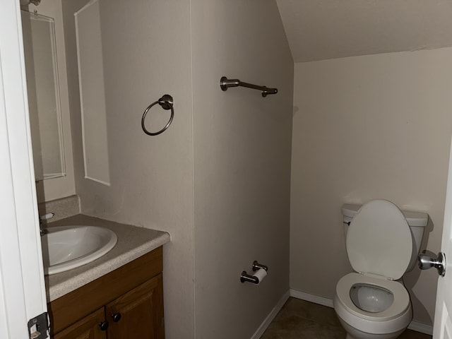 8333 Comanche Rd NE Unit 10B, Albuquerque, NM 87110 - bathroom with vanity, lofted ceiling, and tile patterned floors