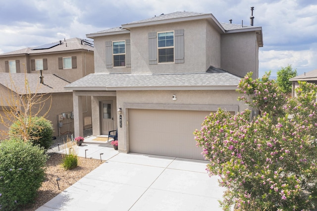 4823 Blackburn Rd NE, Rio Rancho, NM 87144 - traditional home featuring stucco siding, an attached garage, a shingled roof, and concrete driveway