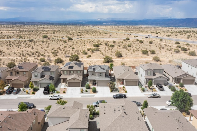 4823 Blackburn Rd NE, Rio Rancho, NM 87144 - aerial perspective of suburban area featuring a mountainous background and a desert landscape