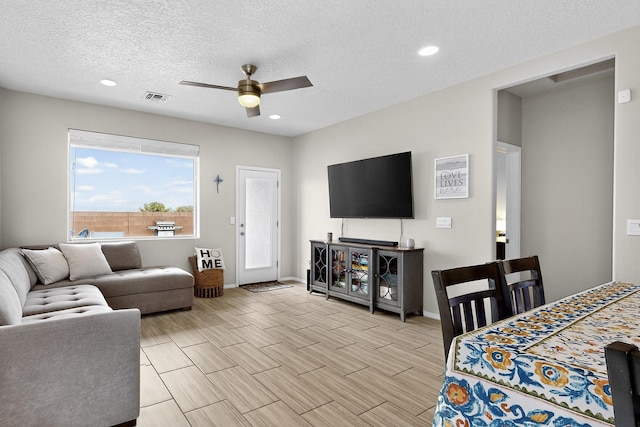 4823 Blackburn Rd NE, Rio Rancho, NM 87144 - living area featuring ceiling fan, recessed lighting, and a textured ceiling