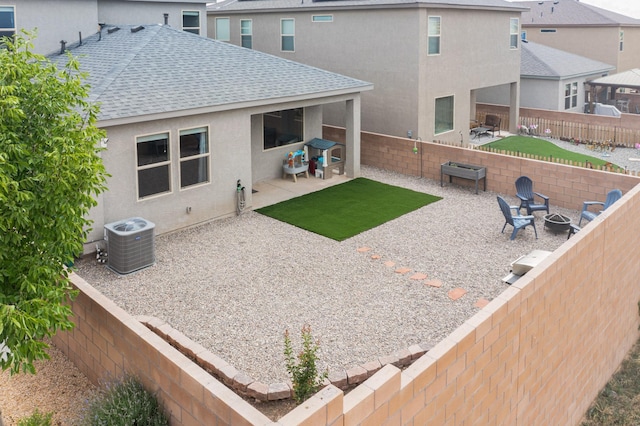 4823 Blackburn Rd NE, Rio Rancho, NM 87144 - rear view of property with a shingled roof, a fire pit, stucco siding, a fenced backyard, and a patio