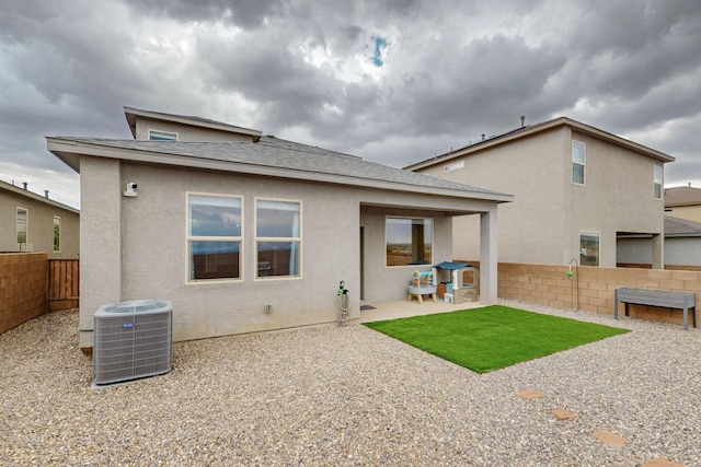 4823 Blackburn Rd NE, Rio Rancho, NM 87144 - rear view of property with a fenced backyard, a patio area, stucco siding, and a shingled roof