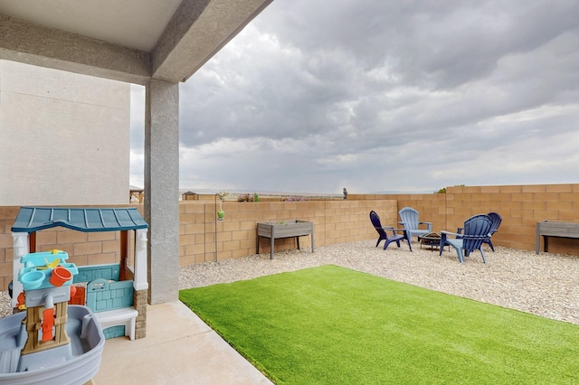 4823 Blackburn Rd NE, Rio Rancho, NM 87144 - fenced backyard with a fire pit and a patio area