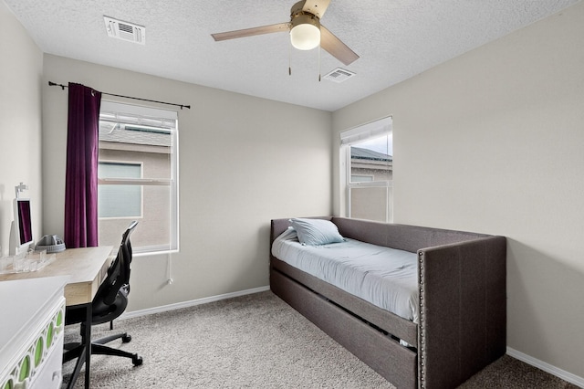 4823 Blackburn Rd NE, Rio Rancho, NM 87144 - bedroom featuring carpet flooring, a desk, a textured ceiling, and a ceiling fan